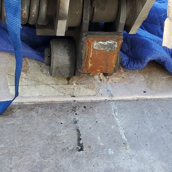 Titan Relocation Services - close up to the lift gate on my driveway and the damage - Movers Near Me - Whittier, California Titan Relocation Services - close up to the lift gate on my driveway and the damage - Movers Near Me - Whittier, California