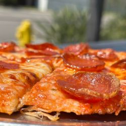 Tony Pepperoni Pizzeria - we sing to it, talk to it, and say supportive, nurturing things to it