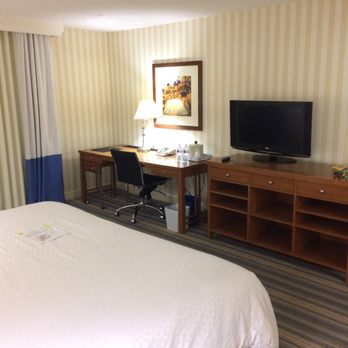 Four Points by Sheraton Bakersfield - Desk and entertainment center with cubbies for clothes - Hotels Near Me - Bakersfield, California