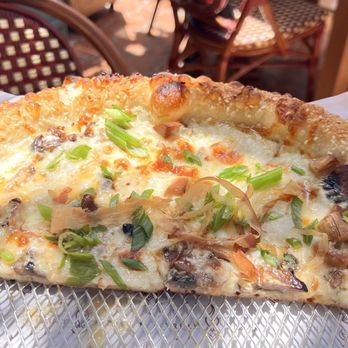 Truly Pizza - Umami Pizza (half eaten ) - Pizza Near Me - Laguna Beach, California Truly Pizza - Umami Pizza (half eaten ) - Pizza Near Me - Laguna Beach, California