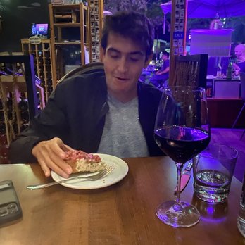 The Rose - My husband enjoying the tuna tartare toast and a glass of wine - Wine Bars Near Me - San Diego, California