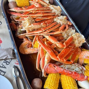 Captain Crab - Captain platter - lobster tail, crab legs, shrimp, crawfish, mussels,  clams, potatoes,  eggs, sausage,  and corn. - Cajun/Creole Near Me - Brooklyn Center, Minnesota