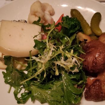 La Raclette - 4 slices of cheese, 2 gherkins, 1/8 of a proper potato portion and some lettuce. - Fondue Near Me - Montreal, Quebec