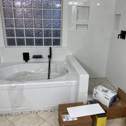 a bathtub in a bathroom a bathtub in a bathroom