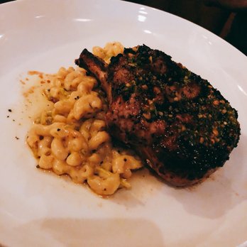 Social Hall - Pork Chop served on top of green Chile Mac and Cheese - Bars Near Me - Tempe, Arizona Social Hall - Pork Chop served on top of green Chile Mac and Cheese - Bars Near Me - Tempe, Arizona