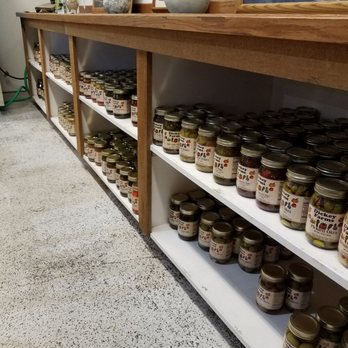 Angel's Bakery - a shelf full of jars of food - Bakeries Near Me