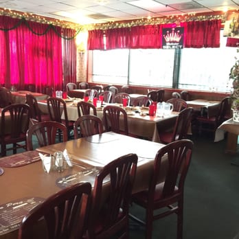 Contigo Peru - a dining room with a christmas tree - Peruvian Near Me - Atlanta, Georgia