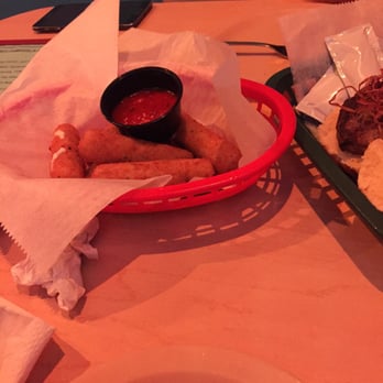 Bayside Bar & Grill - a basket of food on a table - Bars Near Me - Virginia Beach, Virginia