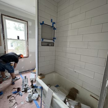 Agl Renovation Services - a man working on a bathroom - Handyman Near Me - Silver Spring, Maryland