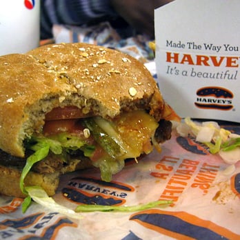 Harvey's - First bite showing more of the wonderful veggie burger. - Fast Food Near Me - Toronto, Ontario