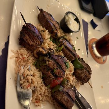 Acropolis Greek Taverna - Steak kabobs over rice my husband had - Bars Near Me - Tampa, Florida
