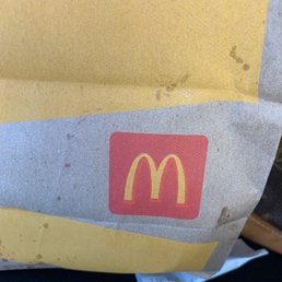a paper bag with a mcdonald's logo a paper bag with a mcdonald's logo