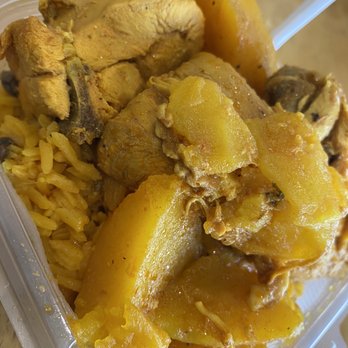 Tu Casa Restaurant - Yellow rice with stew chicken - Latin American Near Me - Orlando, Florida