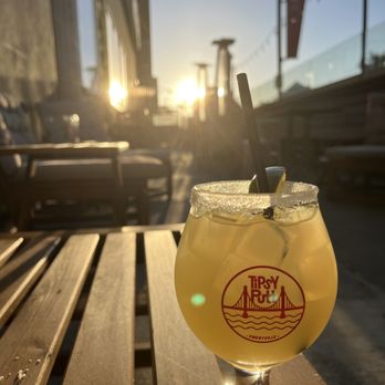 Tipsy Putt - a drink sitting on a wooden table - Pubs Near Me - Emeryville, California Tipsy Putt - a drink sitting on a wooden table - Pubs Near Me - Emeryville, California