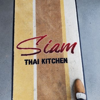 Siam Thai Kitchen - a person standing on a mat - Thai Near Me - Edmonton, Alberta Siam Thai Kitchen - a person standing on a mat - Thai Near Me - Edmonton, Alberta