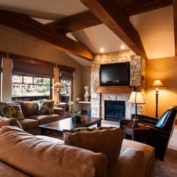 The Chateaux Deer Valley - One- to Four-Bedroom Suites have living rooms with a deck and fireplace,