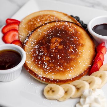 Azara Kitchen - Fluffy, golden-brown buttermilk pancakes, perfectly crisped on the edges and soft in the center. Served with pure maple syrup, fresh season - African Near Me - New York, New York