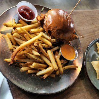 Eureka! - Spicy Fried Chicken Sandwhich with French Fries - American Near Me - Austin, Texas Eureka! - Spicy Fried Chicken Sandwhich with French Fries - American Near Me - Austin, Texas
