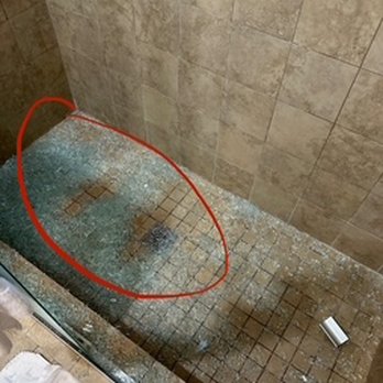 Nite Inn at Universal City - shattered glass. circled area shows where my feet were when the shower exploded. - Hotels Near Me - Studio City, California Nite Inn at Universal City - shattered glass. circled area shows where my feet were when the shower exploded. - Hotels Near Me - Studio City, California