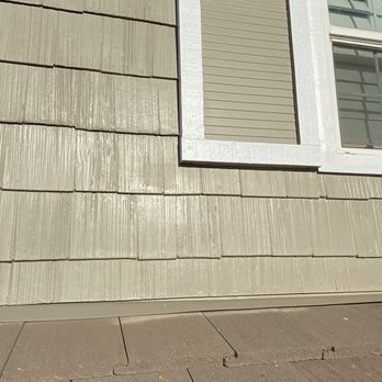 Professionals Painting - hard to see in this picture but if you look at the bottom row of the siding you will notice the uneven paint that is sure to peel. - Painters Near Me