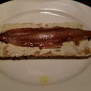 Bodega de la Ardosa - anchoa de la casa marinated in pedro ximenez wine on goat cheese tosta - Wine Bars Near Me - Madrid, M