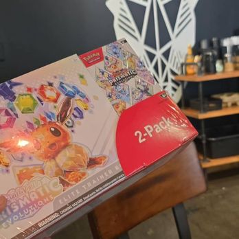 Old World Coffee Roasters - Back wall art with me getting ready to open some pokemon packs. - Coffee & Tea Near Me - Reno, Nevada