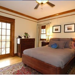 Kara O'Brien Renovations - Addition bedroom that we built with heartpine floors and reclaimed trim