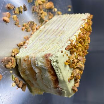 Xt Patisserie - Slice of Pistachio Mille Crepe Cake - Desserts Near Me - Irvine, California Xt Patisserie - Slice of Pistachio Mille Crepe Cake - Desserts Near Me - Irvine, California