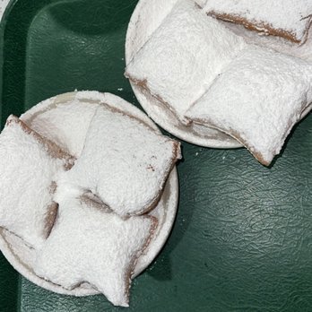 Cafe Du Monde - two pastries on a green tray - Coffee & Tea Near Me - Covington, Louisiana