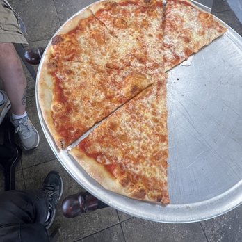 Mimmos Pizza - Pizza pie. She started serving us before taking a photo shoot - Pizza Near Me - Melbourne, Florida