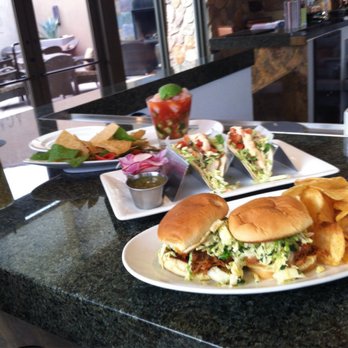 Agave Grill & Bar - Fish tacos seafood cocktail y pull porked on sweet toasted bread with crisps. - American Near Me - Palm Desert, California Agave Grill & Bar - Fish tacos seafood cocktail y pull porked on sweet toasted bread with crisps. - American Near Me - Palm Desert, California