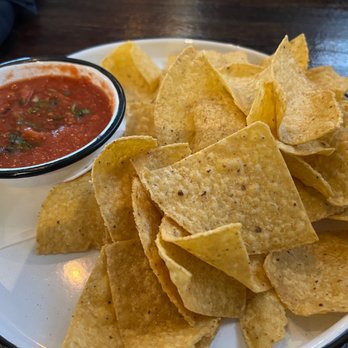 Santo Patio - Chips and warm salsa. Warm salsa is actually pretty good! - Mexican Near Me - Del Valle, Texas