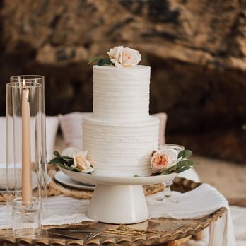 Layers Sensational Cakes - a wedding cake on a table - Bakeries Near Me - Monterey, California
