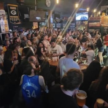 Duke's On Water - a large group of people at a bar - Sports Bars Near Me - Milwaukee, Wisconsin Duke's On Water - a large group of people at a bar - Sports Bars Near Me - Milwaukee, Wisconsin