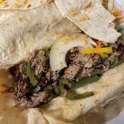 I'm not sure what it is other than a tortilla filled with dried meat and raw vegetables no sauce, cheese or anything else.