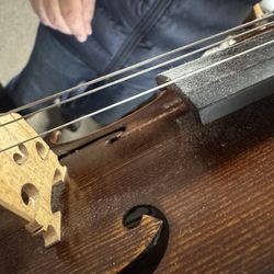 Solo Classic Inc. - Roumen, the maker, fixing up my daughter's instrument.