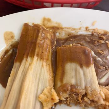 La Casita Mexican Restaurant - Half eaten tamales. I'll ask for more of this great sauce next time! - Mexican Near Me - Crystal River, Florida