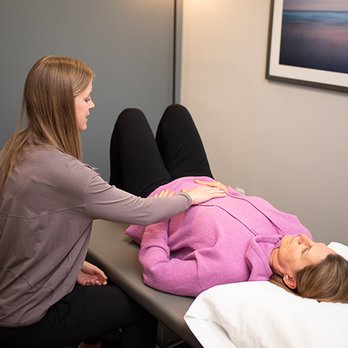 Saunders Therapy Centers - Physical Therapist assessing teaching exercise for pelvic health. - Physical Therapy Near Me - Saint Paul, Minnesota
