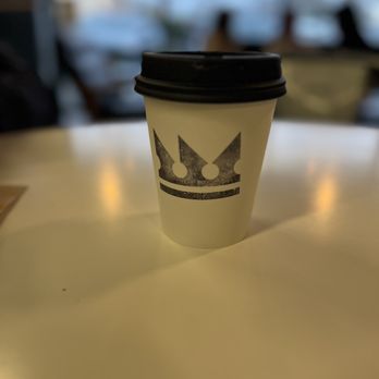 Kingdom Coffee Roasters - a cup of coffee on a table - Coffee Roasteries Near Me - Folsom, California