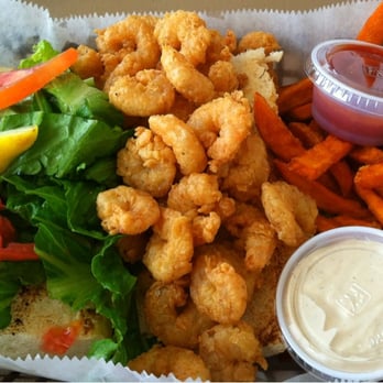 Sunset Grille - Shrimp Po Boy with sweet potato fries at Sunset Grille. - Seafood Near Me - Pensacola, Florida Sunset Grille - Shrimp Po Boy with sweet potato fries at Sunset Grille. - Seafood Near Me - Pensacola, Florida