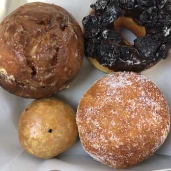 Aloha Sweet Delites - Top left: buttermilk donut Top right: oreo chocolate donut Bottom left: ube "puff"? Bottom right: cream malasada - Bakeries Near Me - Kaumakani, Hawaii