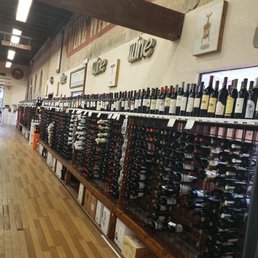a wide selection of wine bottles a wide selection of wine bottles