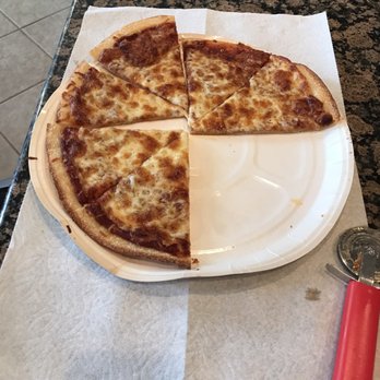 Papa Murphy's - a half eaten pizza on a paper plate - Pizza Near Me - Frisco, Texas Papa Murphy's - a half eaten pizza on a paper plate - Pizza Near Me - Frisco, Texas