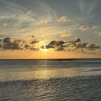 Snoopy's Pier - Sunset as seen from Snoopy's Pier - Seafood Near Me - Corpus Christi, Texas Snoopy's Pier - Sunset as seen from Snoopy's Pier - Seafood Near Me - Corpus Christi, Texas