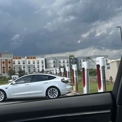 Tesla Supercharger - Charger stalls looking toward the hotels