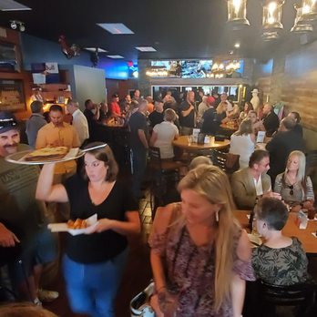 Rusty Rooster Saloon - a crowd of people eating and drinking - Bars Near Me - Warren, Michigan