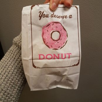 Donut Palace - a person holding a bag of donuts - Breakfast & Brunch Near Me - Vicksburg, Mississippi Donut Palace - a person holding a bag of donuts - Breakfast & Brunch Near Me - Vicksburg, Mississippi