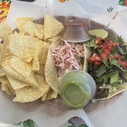 Taco lunch combo chicken and Americano tacos, guac and red salsa