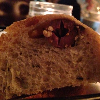 Parizade - Table bread with olives in it! Had to snap a photo, never seen that before. - Mediterranean Near Me - Durham, North Carolina Parizade - Table bread with olives in it! Had to snap a photo, never seen that before. - Mediterranean Near Me - Durham, North Carolina