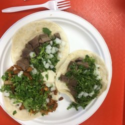 Taquiera Manriquez - 2 tongue tacos and an al pastor taco. The red and green salsas were great, they both had a little bit of heat and great flavor.